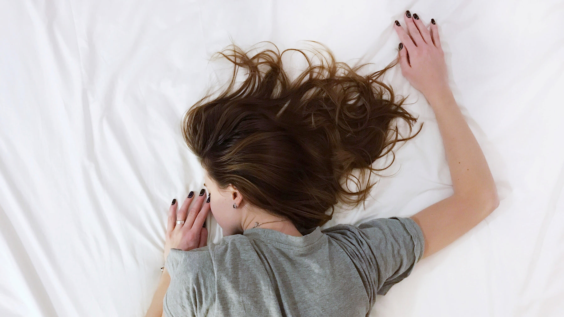 A woman laying on a bed