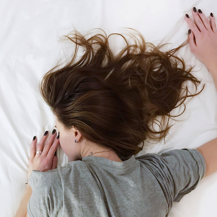 A woman laying on a bed