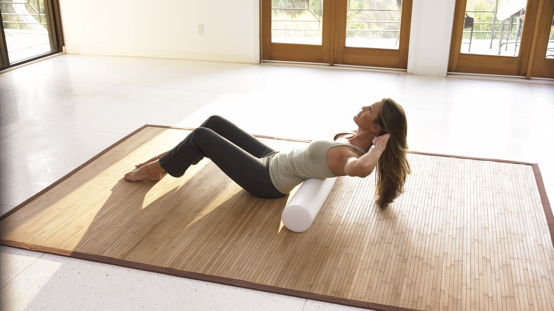 Woman using a foam roller