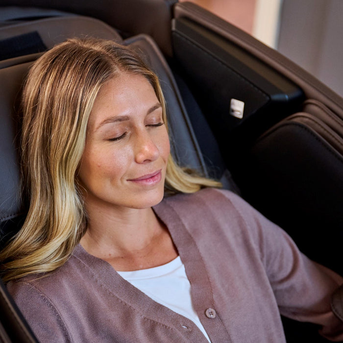 EveryBody Deserves a Massage Week - Woman sitting in a massage chair