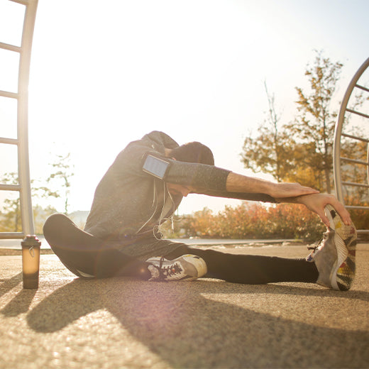 Man in workout clothes stretching