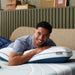 Man laying on the TEMPUR-Adapt® Pro Pillow