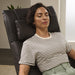 A woman using the Circa Zero Gravity Swivel Chair by Human Touch in espresso | Relax The Back